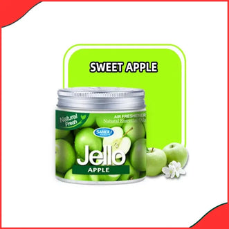 The Jello Apple air freshener gel placed inside a car's cup holder, emphasizing its use and long-lasting freshness.