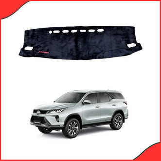 Premium black velvet dash mat custom-contoured for the Toyota Fortuner 2016-2021 dashboard, showing material quality and precise sensor cutouts.