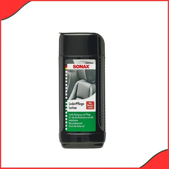 Sonax leather care lotion being applied on a car seat interior using a microfiber cloth